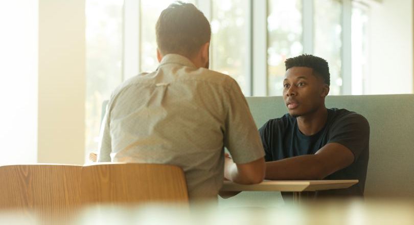 Two people discussing mental health