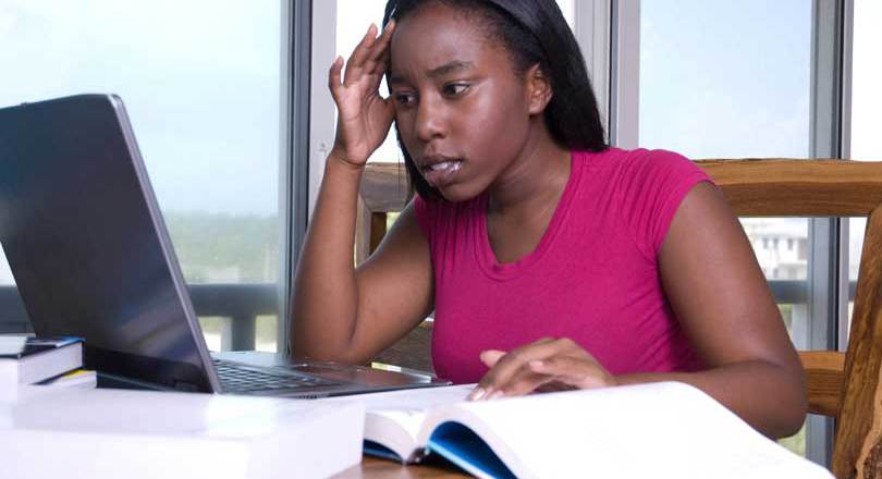 black woman studying with laptop